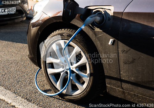 Image of BMW i electric car being charged