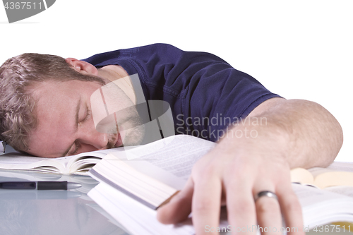 Image of College Student Sleeping on his Desk