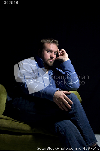 Image of Sad Man Sitting on a Chair