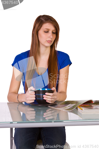 Image of Beautiful Woman Reading a Magazine