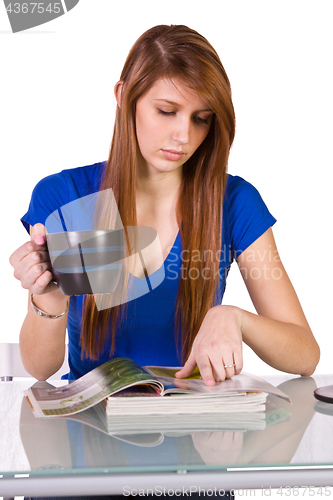 Image of Beautiful Woman Reading a Magazine