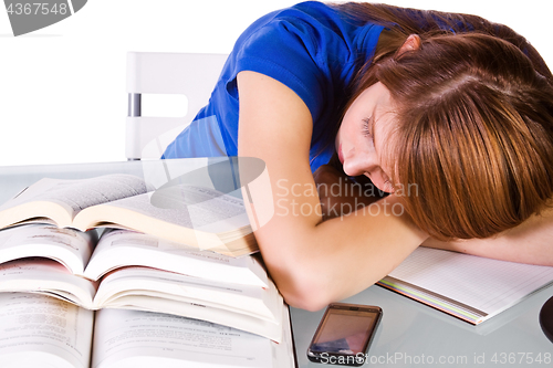 Image of College Student Sleeping on her Desk