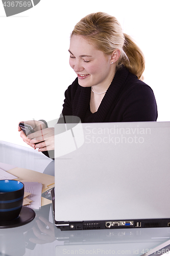 Image of Businesswoman at His Desk Working