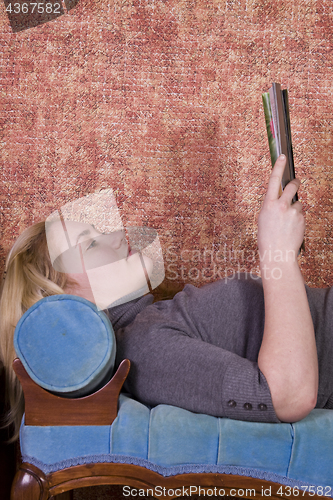 Image of Beautiful Woman Reading a Magazine