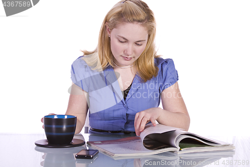 Image of Beautiful Woman Reading a Magazine