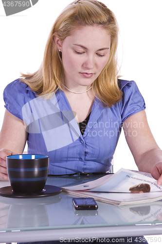 Image of Beautiful Woman Reading a Magazine