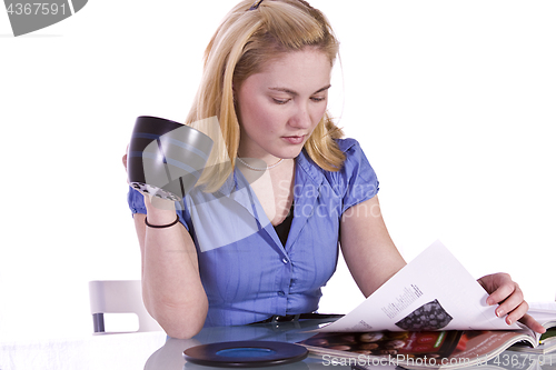 Image of Beautiful Woman Reading a Magazine