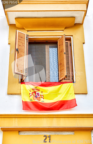 Image of The national flag of Spain hang on the balcony