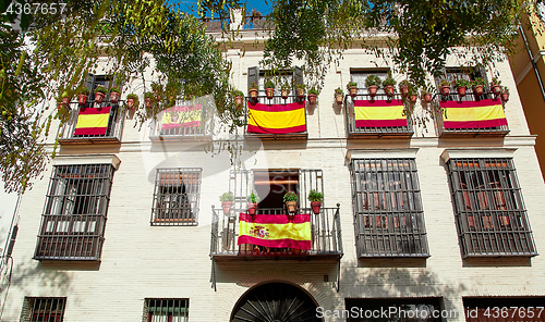 Image of The national flags of Spain hang on the balcony