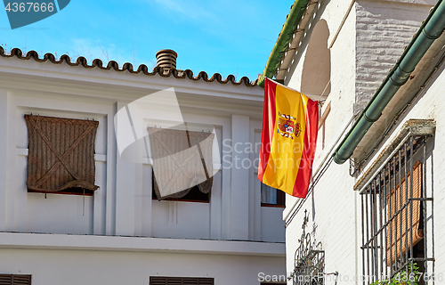 Image of The national flag of Spain hang on the balcony