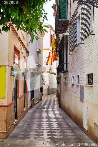 Image of The national flag of Spain hang on the balcony