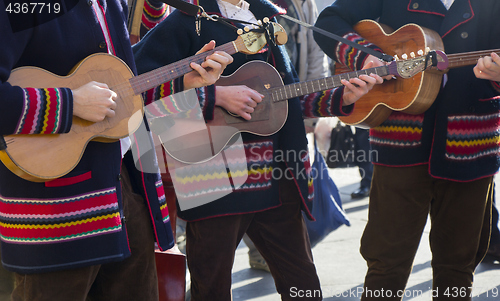 Image of Croatian tamburitza musicians in traditional Croatian folk costu