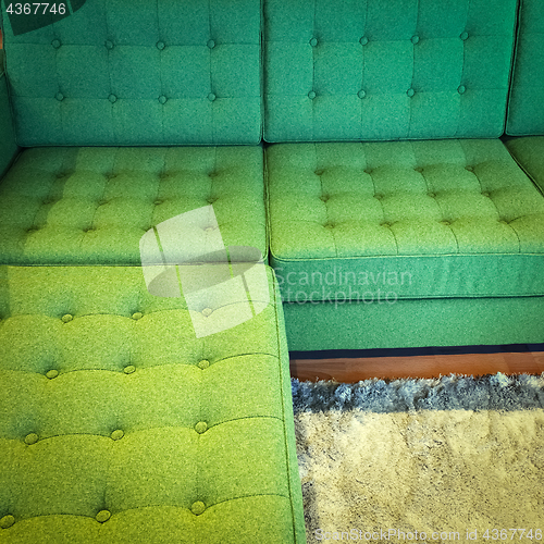 Image of Comfortable green corner sofa