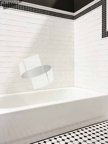 Image of New modern bathroom with white tile walls