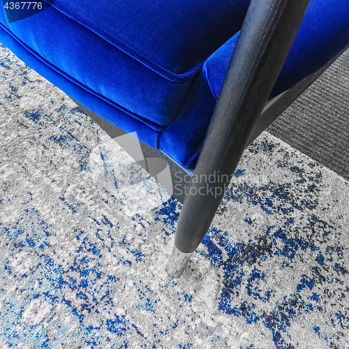 Image of Close-up of a luxurious blue velvet armchair