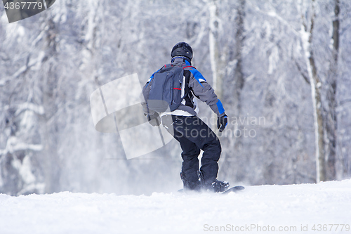 Image of Winter sport snowboarder at ski slopeand alps mountains landscap