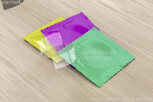 Image of Condoms on wooden table 