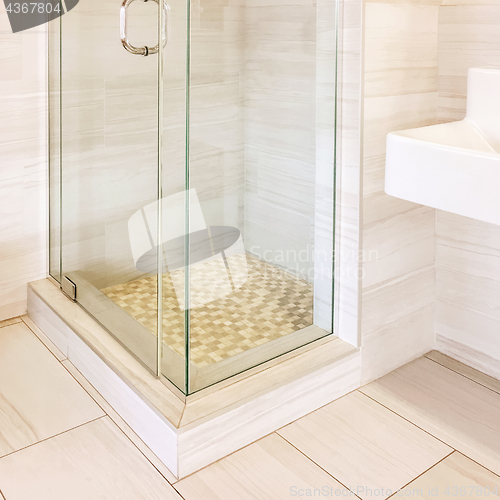 Image of Modern shower with tiled walls and floor