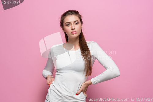 Image of The young woman\'s portrait with proud and arrogant emotions