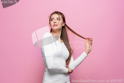 Image of The young woman\'s portrait with thoughtful emotions