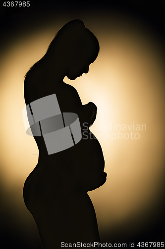 Image of Silhouette of pregnant woman monochrome