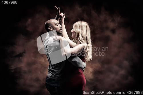 Image of Young couple dances Caribbean Salsa