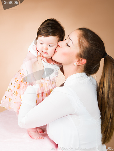 Image of mother and six months old baby girl