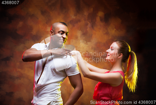 Image of Young couple dances Caribbean Salsa