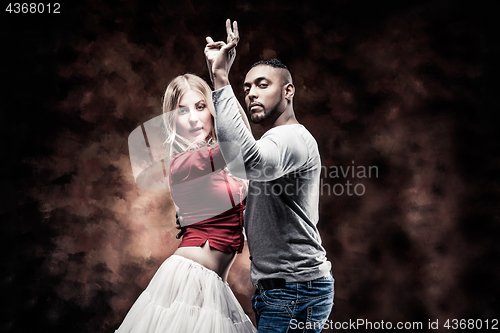 Image of Young couple dances Caribbean Salsa