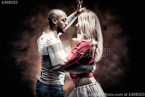 Image of Young couple dances Caribbean Salsa