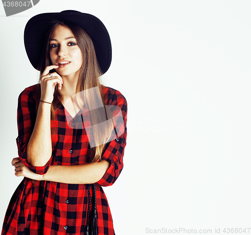 Image of young pretty brunette girl hipster in hat on white background casual close up dreaming smiling