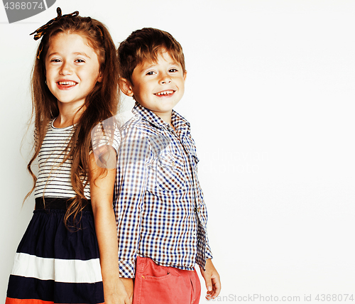 Image of little cute boy and girl hugging playing on white background, ha