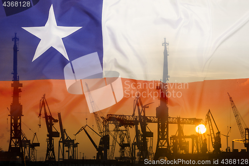 Image of Industrial concept with Chile flag at sunset