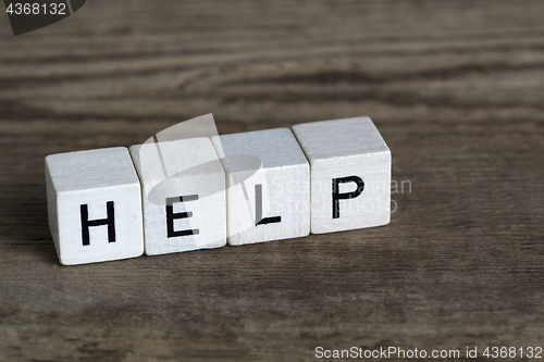 Image of Help, written in cubes