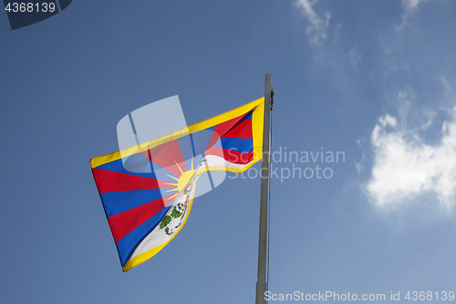 Image of National flag of Tibet on a flagpole