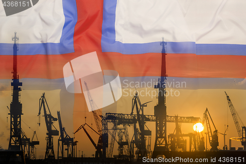 Image of Industrial concept with Faroe Islands flag at sunset