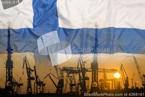 Image of Industrial concept with Finland flag at sunset