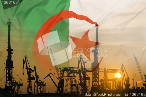 Image of Industrial concept with Algeria flag at sunset