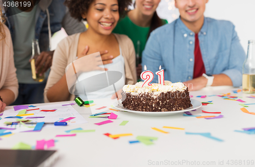 Image of team greeting coworker at office birthday party