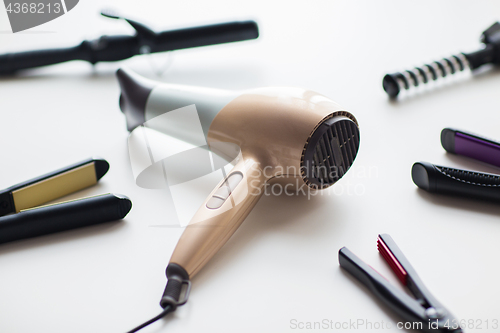 Image of hairdryer, hot styling and curling irons