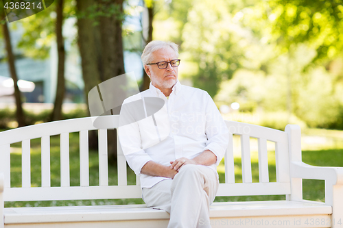 Image of sad senior man at summer park