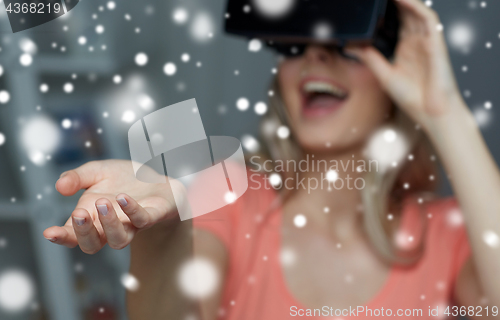 Image of happy woman in virtual reality headset or glasses