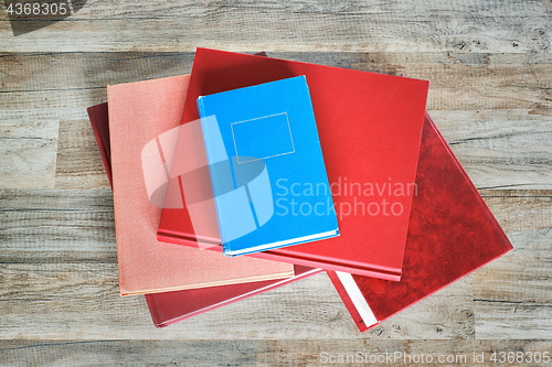 Image of stack of books on the floor