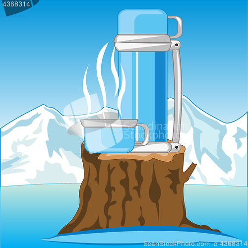 Image of Thermos with hot tea on nature in winter