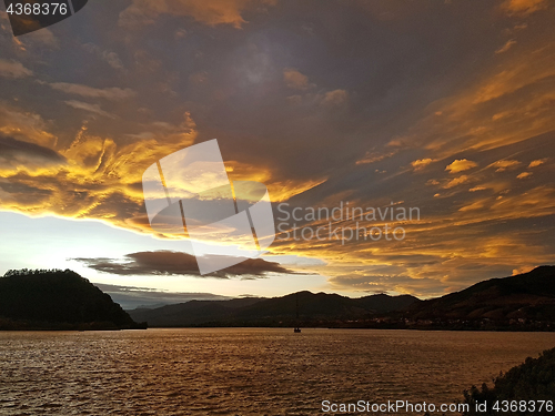 Image of Sunset clouds over the lake