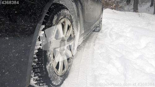 Image of Car tires on winter road