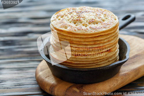 Image of Pancakes in a cast iron pan.