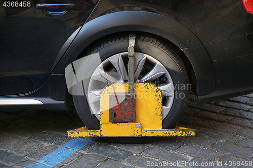 Image of Car was locked with clamped vehicle, wheel lock because of illeg