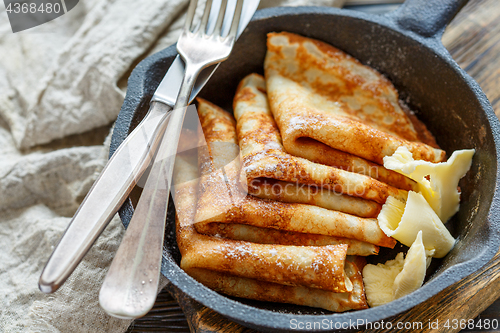 Image of Crepes with butter sprinkled with powdered sugar.