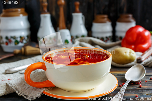 Image of Thick soup goulash in a ceramic bowl.